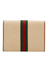 beige vertikal gestreifte Segeltuch Clutch von Gucci