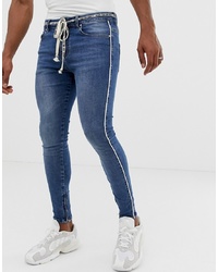 blaue bedruckte enge Jeans