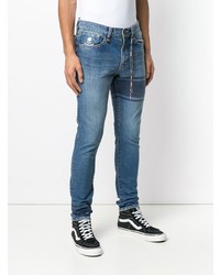 blaue bedruckte enge Jeans von Mastermind World