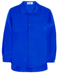 blaue Bluse mit Knöpfen