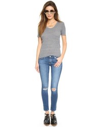 blaue enge Jeans mit Destroyed-Effekten von AG Jeans