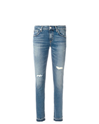 blaue enge Jeans mit Destroyed-Effekten von Agolde