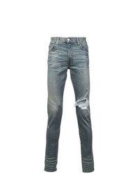 blaue enge Jeans mit Destroyed-Effekten von Amiri