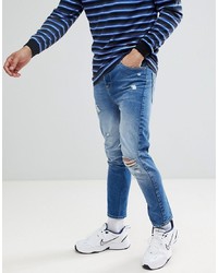 blaue enge Jeans mit Destroyed-Effekten von ASOS DESIGN