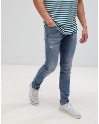 blaue enge Jeans mit Destroyed-Effekten von ASOS DESIGN