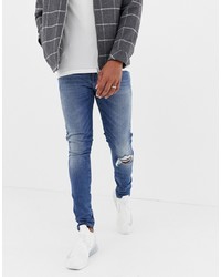 blaue enge Jeans mit Destroyed-Effekten von ASOS DESIGN