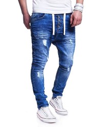 blaue enge Jeans mit Destroyed-Effekten von behype