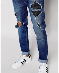 blaue enge Jeans mit Destroyed-Effekten von Asos