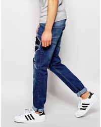 blaue enge Jeans mit Destroyed-Effekten von Asos