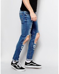 blaue enge Jeans mit Destroyed-Effekten von Asos