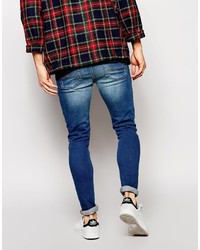 blaue enge Jeans mit Destroyed-Effekten von Asos