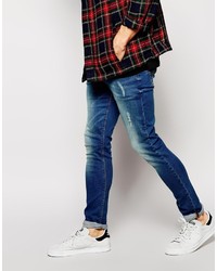 blaue enge Jeans mit Destroyed-Effekten von Asos