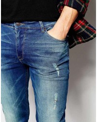 blaue enge Jeans mit Destroyed-Effekten von Asos