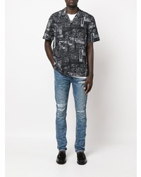 blaue enge Jeans mit Destroyed-Effekten von Ksubi