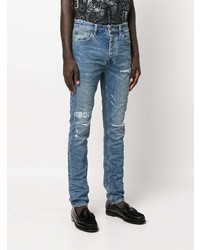 blaue enge Jeans mit Destroyed-Effekten von Ksubi