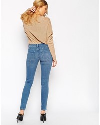 blaue enge Jeans mit Destroyed-Effekten von Asos