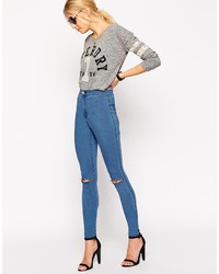 blaue enge Jeans mit Destroyed-Effekten von Asos