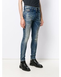 blaue enge Jeans mit Destroyed-Effekten von Diesel