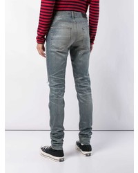 blaue enge Jeans mit Destroyed-Effekten von Amiri