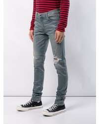 blaue enge Jeans mit Destroyed-Effekten von Amiri