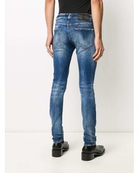 blaue enge Jeans mit Destroyed-Effekten von John Richmond