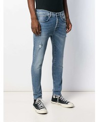 blaue enge Jeans mit Destroyed-Effekten von PRPS