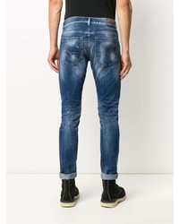 blaue enge Jeans mit Destroyed-Effekten von Dondup