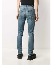 blaue enge Jeans mit Destroyed-Effekten von Philipp Plein