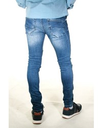 blaue enge Jeans mit Destroyed-Effekten von EX-PENT