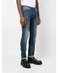 blaue enge Jeans mit Destroyed-Effekten von Dondup