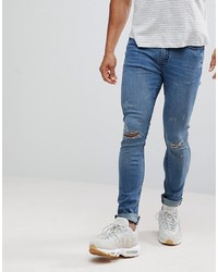 blaue enge Jeans mit Destroyed-Effekten von Hoxton Denim