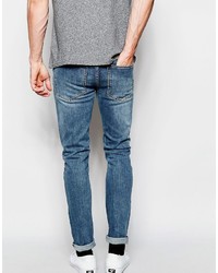 blaue enge Jeans mit Destroyed-Effekten von Cheap Monday