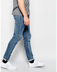 blaue enge Jeans mit Destroyed-Effekten von Cheap Monday