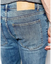 blaue enge Jeans mit Destroyed-Effekten von Cheap Monday