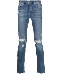 blaue enge Jeans mit Destroyed-Effekten von Ksubi