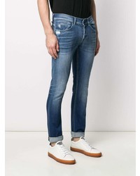 blaue enge Jeans mit Destroyed-Effekten von Dondup