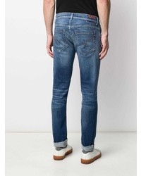 blaue enge Jeans mit Destroyed-Effekten von Dondup