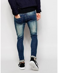 blaue enge Jeans mit Destroyed-Effekten von Asos