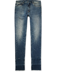 blaue enge Jeans mit Destroyed-Effekten von Maison Margiela