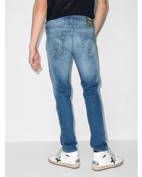 blaue enge Jeans mit Destroyed-Effekten von True Religion