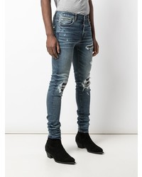 blaue enge Jeans mit Destroyed-Effekten von Amiri