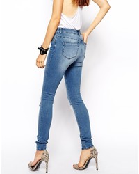 blaue enge Jeans mit Destroyed-Effekten von Asos