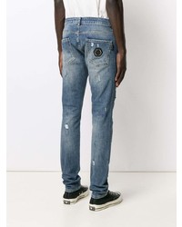 blaue enge Jeans mit Destroyed-Effekten von Philipp Plein