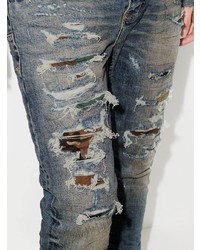 blaue enge Jeans mit Destroyed-Effekten von purple brand