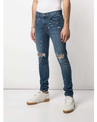 blaue enge Jeans mit Destroyed-Effekten von DOMREBEL