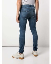 blaue enge Jeans mit Destroyed-Effekten von DOMREBEL