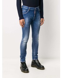 blaue enge Jeans mit Destroyed-Effekten von DSQUARED2