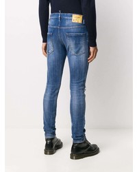 blaue enge Jeans mit Destroyed-Effekten von DSQUARED2