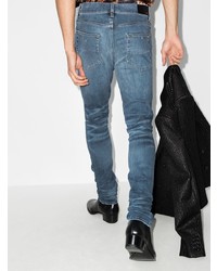 blaue enge Jeans mit Destroyed-Effekten von Amiri