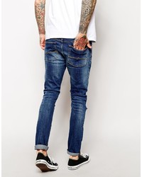 blaue enge Jeans mit Destroyed-Effekten von Asos